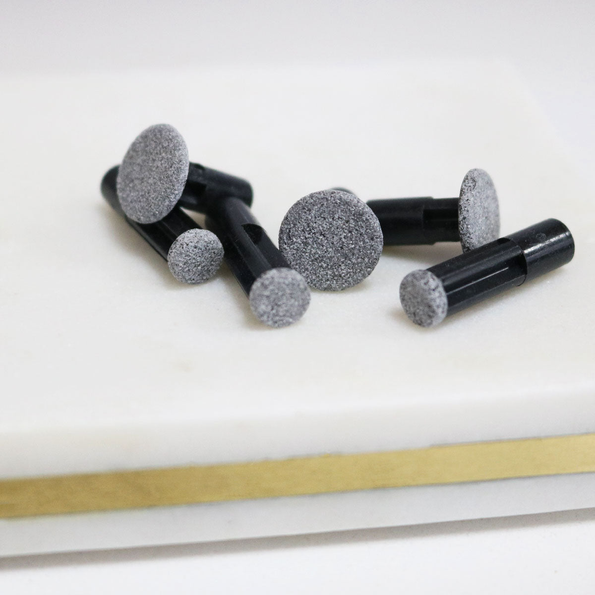 black discs on white tray