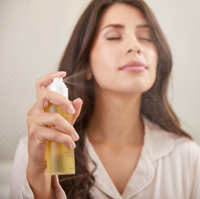 Woman using PMD Skincare for desktop background