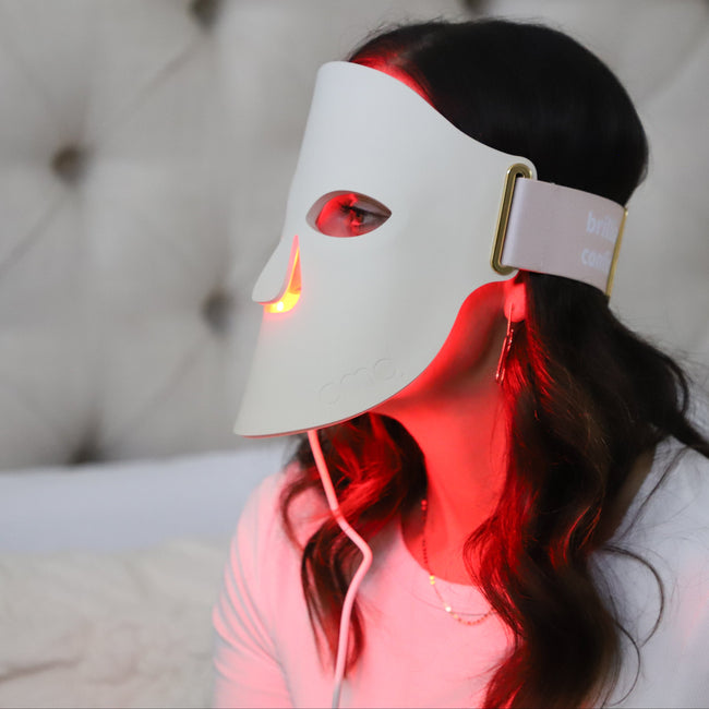 Woman using PMD LED Mask for desktop background image