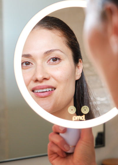 Woman using PMD reflect pro for mobile background