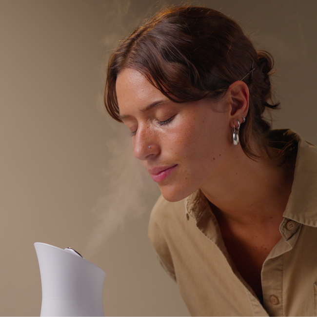 Woman using PMD Silksteam using for desktop background