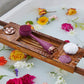 AT-4003-EBerry?Berry PMD Clean Body on bath tray surrounded by flowers